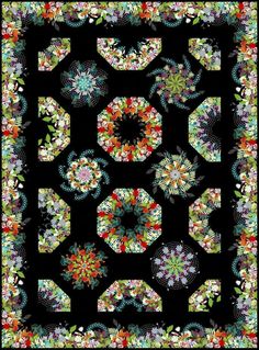 a black quilt with colorful flowers and leaves on the front, along with an intricate design