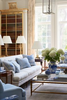 a living room with blue and white furniture