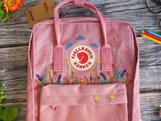 Welcome to my store and choose the perfect hand-embroidered fjallraven kanken backpack   Version & Size + Medium size: 38x27x13cm  + Big size: 42x32x13cm  - Product price includes: hand-embroidered fjallraven kanken backpack and design as shown in the picture - I can make fjallraven kanken backpack hand embroidery patterns according to your ideas - fjallraven kanken backpack will be hand embroidered with thread that won't fade when washed - fjallraven kanken backpack has a small front compartmen Kanken Backpack Embroidery, Vietnam Market, Wildflower Embroidery, Phone Light, Backpack Fjallraven, Teen's Backpack, Embroidered Backpack, Diy Backpack, Hand Embroidery Patterns