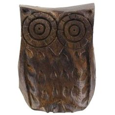 an owl statue is shown on a white background