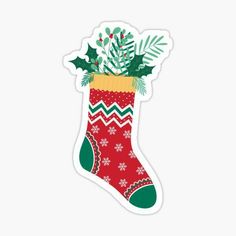 a christmas stocking with holly and mist on it sticker is hanging from the wall