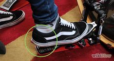 a person riding a skateboard on top of a red carpet