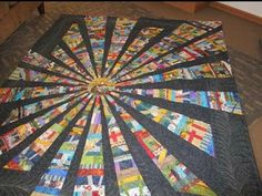 a quilted table topper with many different designs on it