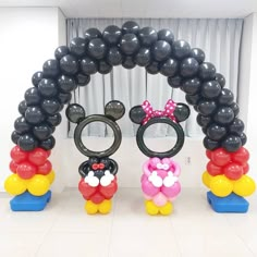 mickey and minnie mouse balloon arch with balloons