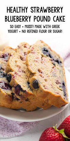 blueberry pound cake on a white plate with strawberries next to it and the text healthy strawberry blueberry pound cake so easy & made with greek yogurt