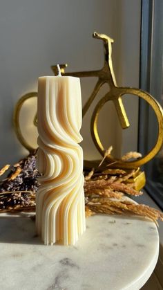 a candle sitting on top of a marble table