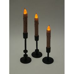 Add a warm glow to your home decor with this beautiful mid-century modern style black cast iron taper candle holder set. Taper candles are the perfect way to add extra ambiance to your home, and this graduated set of three holders makes a wonderful accent. Made of heavy cast iron, they feature a smooth black painted finish. Use them to decorate the tables and shelves in your living room and bedroom, or create a festive centerpiece for Thanksgiving and Christmas. The holders are 8 inches, 6 inch… Festive Centerpieces, Taper Candle Holder, Thanksgiving And Christmas, Taper Candle Holders, Candle Holder Set, Iron Metal, Taper Candles, Mid Century Modern Style, Paint Finishes