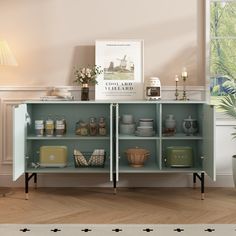 a room with a shelf filled with dishes and vases