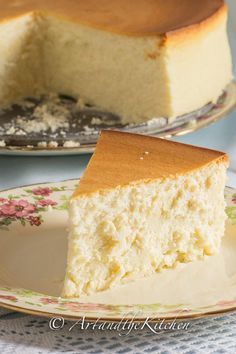 a piece of cake on a plate with a fork next to it and another slice in the background