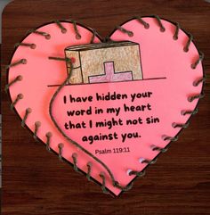 a pink heart shaped cake with a bible verse on it's side and the words i have hidden your word in my heart that i might not sin against you