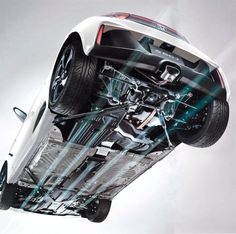 a white car is shown with its front wheels in the air and it's suspensions exposed