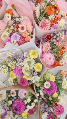 several bouquets of flowers are laid out on the ground