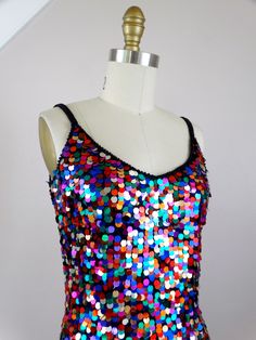 "This fun vintage party dress! It is fully embellished with rainbow paillette sequins and in excellent condition! Size SMALL Measurements: Bust - 32\" Waist - 26\" Hips - 36\" Length - 34\" Tag Size - 4 / Small (please refer to measurements) Size MEDIUM Measurements: Bust - 34\" Waist - 28\" Hips - 38\" Length - 33\" Tag Size - 6 /Medium (please refer to measurements) This dress comes from a pet-free and smoke-free home. If you would like more info or have any questions, please don't hesitate to Embellished Party Dress, Vintage Party Dress, Vintage Party Dresses, Checkered Jacket, Sequined Dress, Chores For Kids, Sequin Jacket, Still In Love, Beaded Gown