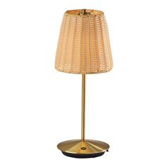 a table lamp with a gold base and a light shade on it's side