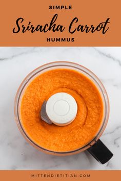 a food processor with carrots in it and the words simple sricha carrot hummus