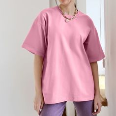 Size Bust(cm) Shoulder(cm) Sleeve(cm) Length(cm) M 100 48 19 68 L 106 50 20 70 XL 112 52 21 72 XXL 118 54 22 74 Introducing our latest summer collection: the Solid Color Cotton Short-Sleeve T-Shirt. Made from 100% cotton, this shirt offers a soft and comfortable feel, perfect for all-day wear. Its fashionable yet simple design makes it easy to style for any occasion, whether it's a casual outing, a day at work, or a holiday celebration. This versatile piece is a wardrobe essential, ideal for dai Oversized Basic Solid Color T-shirt, Oversized Solid Color Crew Neck T-shirt, Oversized Pink Top With Crew Neck, Oversized Solid Crew Neck T-shirt, Basic Plain Drop Shoulder T-shirt, Pink Solid Color T-shirt For Spring, Solid Color Plain Drop Shoulder Tops, Pink Short Sleeve Solid Color Top, Oversized Basic Solid Color Top