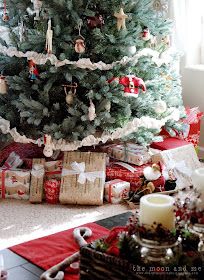 a decorated christmas tree with presents under it