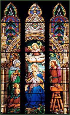 a stained glass window depicting the birth of jesus