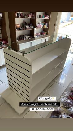 a white counter sitting inside of a store