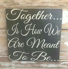 a sign that says together is how we are meant to be on a wooden wall