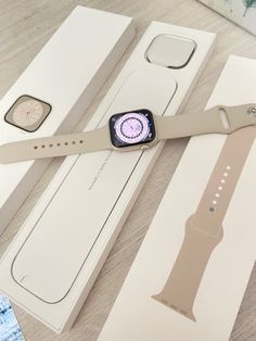 an apple watch is sitting in its box next to the packaging for it's new strap