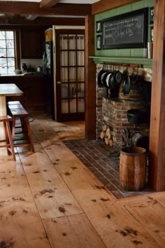 the kitchen is clean and ready for us to use in the day time, as well as cooking utensils on the fireplace