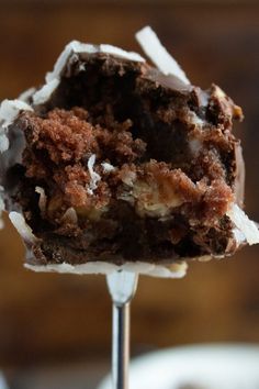 a close up of a piece of cake on a stick