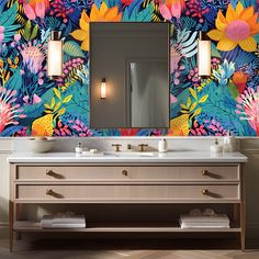 a bathroom with a floral wallpaper and two sinks in front of a large mirror