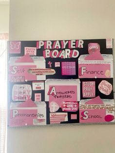 a bulletin board with pink and black stickers on it