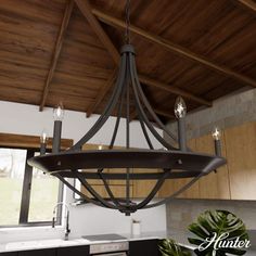 a chandelier hanging from the ceiling in a kitchen