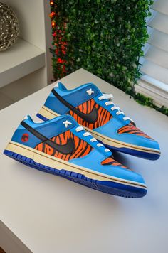 Custom made Thundercats Tygra dunks.  Sneakers are 100% authentic Nike Dunks, while the design has been painted with acrylic leather paints.  The sneakers are a size  US 11.5 mens. Custom Dunk Low, Custom Dunks, Jordans Pink, Dunks Sneakers, Shoe Concept, Sneaker Ideas, Nike Collection, Air Sneakers, Urban Shoes