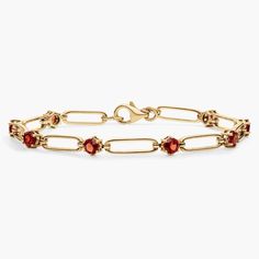 Go for casually luxurious style with this elegant paper clip bracelet featuring gleaming 14k yellow gold design. Between each paper clip link nestles a passionate red garnet stone, adding a touch of bold color to your wrist. Paper Clip Bracelet, Paperclip Bracelet, Garnet Bracelet, Garnet Stone, Blue Nile, Bold Color, Gemstone Bracelets, Red Garnet, Gold Design