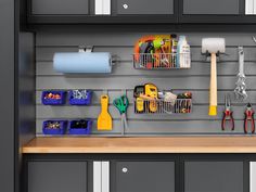 there are many different items on the wall in this garage storage area that is organized with bins, scissors, and other tools