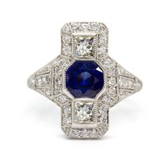 The Florence ring is an authentic vintage ring from the Art Deco era circa 1920. It centers one natural round cut sapphire that weighs 1.10ctw. It exhibits 2 French cut diamonds of J color VS1 clarity that weigh 0.45ctw and 42 old mine cut diamonds of I color and VS1 clarity that weigh 0.45ctw. This ring is currently size 7 ¼ and can be sized. Total weight: 4.1 dwt/ 6.4 grams Ring measurement: 19mm by 11mm by 6mm Doing The Right Thing, French Cut, Art Deco Era, Art Deco Jewelry, Contemporary Jewelry, Natural Sapphire, Vintage Ring, Gemstone Colors, Diamond White