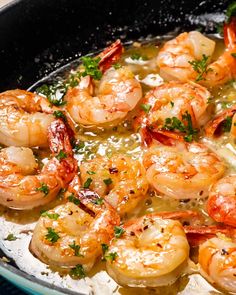 cooked shrimp with parsley in a skillet ready to be served on the table