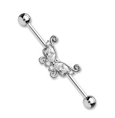 a piercing with an ornate design and crystal stones on the end, is shown in white gold