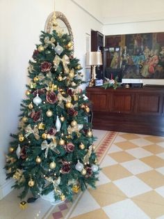 a decorated christmas tree in the middle of a room