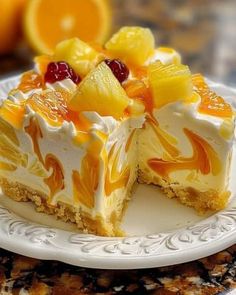 a piece of cake on a plate with oranges and cranberries in the background