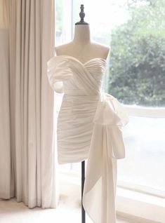 a dress on display in front of a window