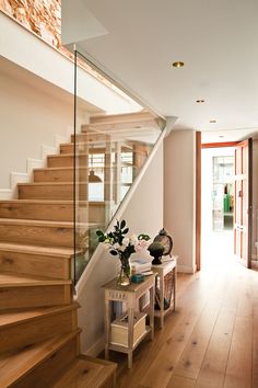 an image of a house with stairs and wooden flooring on the bottom right hand side