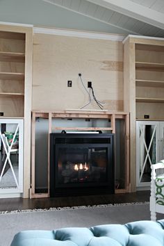 a living room filled with furniture and a fire place