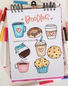 an open notebook with doodles on the cover and various coffees, muffins, and cupcakes