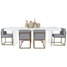 a dining table with four chairs and two vases on top of it, in front of a white background