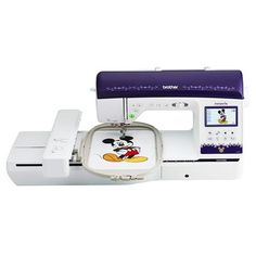 the sewing machine has mickey mouse on it's front and side buttons, as well as an applique