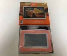 an orange and black box with a small electronic device in it's packaging on a white surface