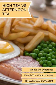 a white plate topped with meat, peas and fried eggs next to french fries on a table