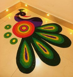 a colorfully decorated floor with lights on the side and an image of a peacock