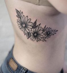 a woman's stomach with flowers on it