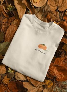 Fun and cute fall sweatshirt, perfect for back to school or university. This handmade 'hey there pumpkin' design sweatshirt is fun and cozy, made with ethically sourced cotton. It is a perfect gift in line with the fall season, bringing a warm and festive vibe to the wearer. Ideal for students heading back to school or anyone looking to embrace the autumn spirit. Product features - Made with a medium-heavy fabric blend of 50% cotton and 50% polyester for coziness during colder months - Ribbed kn White Fall Sweatshirt, Cute Relaxed Fit Sweatshirt For Fall, Cute Fall Letter Print Sweatshirt, Cute Letter Print Sweatshirt For Fall, Fall Sweatshirt With Letter Print And Comfortable Fit, Fall Cotton Orange Sweater, Cute Fall T-shirt, Fall Everyday Cotton Sweatshirt, Comfortable Fit Sweatshirt For Everyday Fall Wear