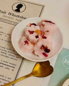 a white bowl filled with ice cream on top of a table